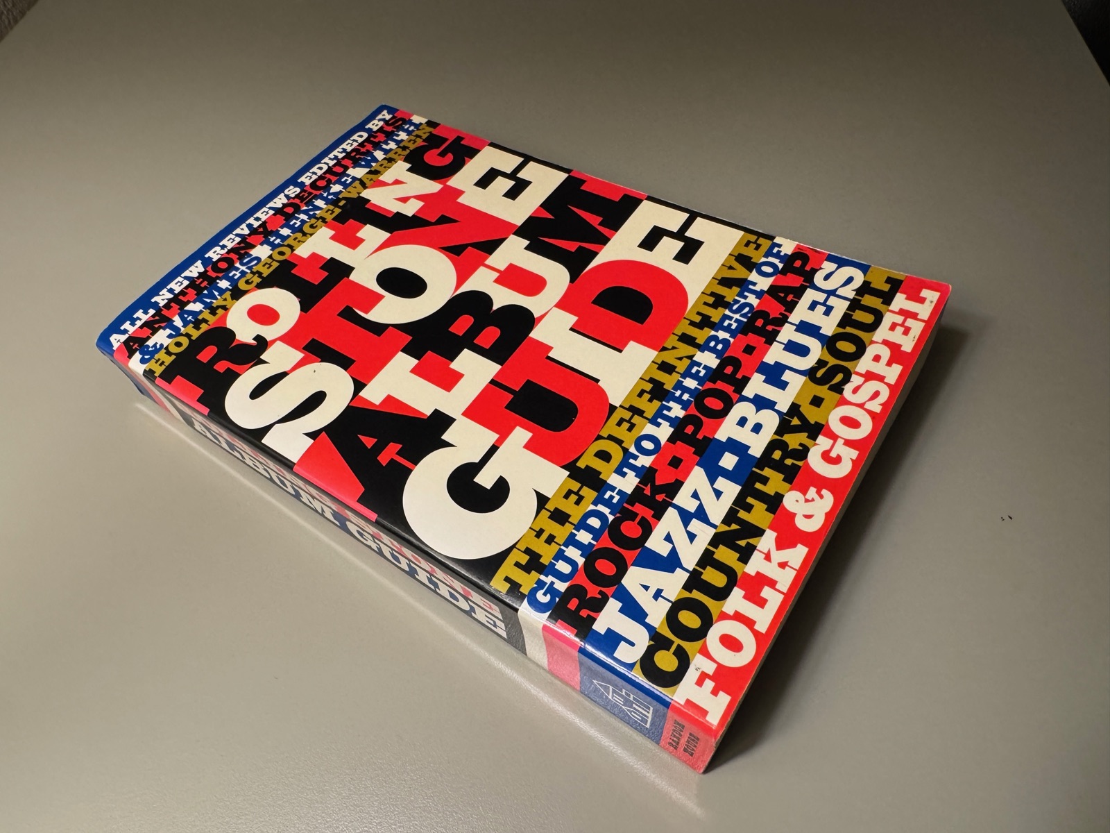 The Rolling Stone Album Guide, a thick paperback with a bold red, white, blue and black typographic cover